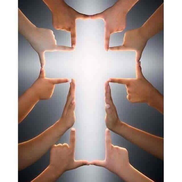Cross formed by human hands